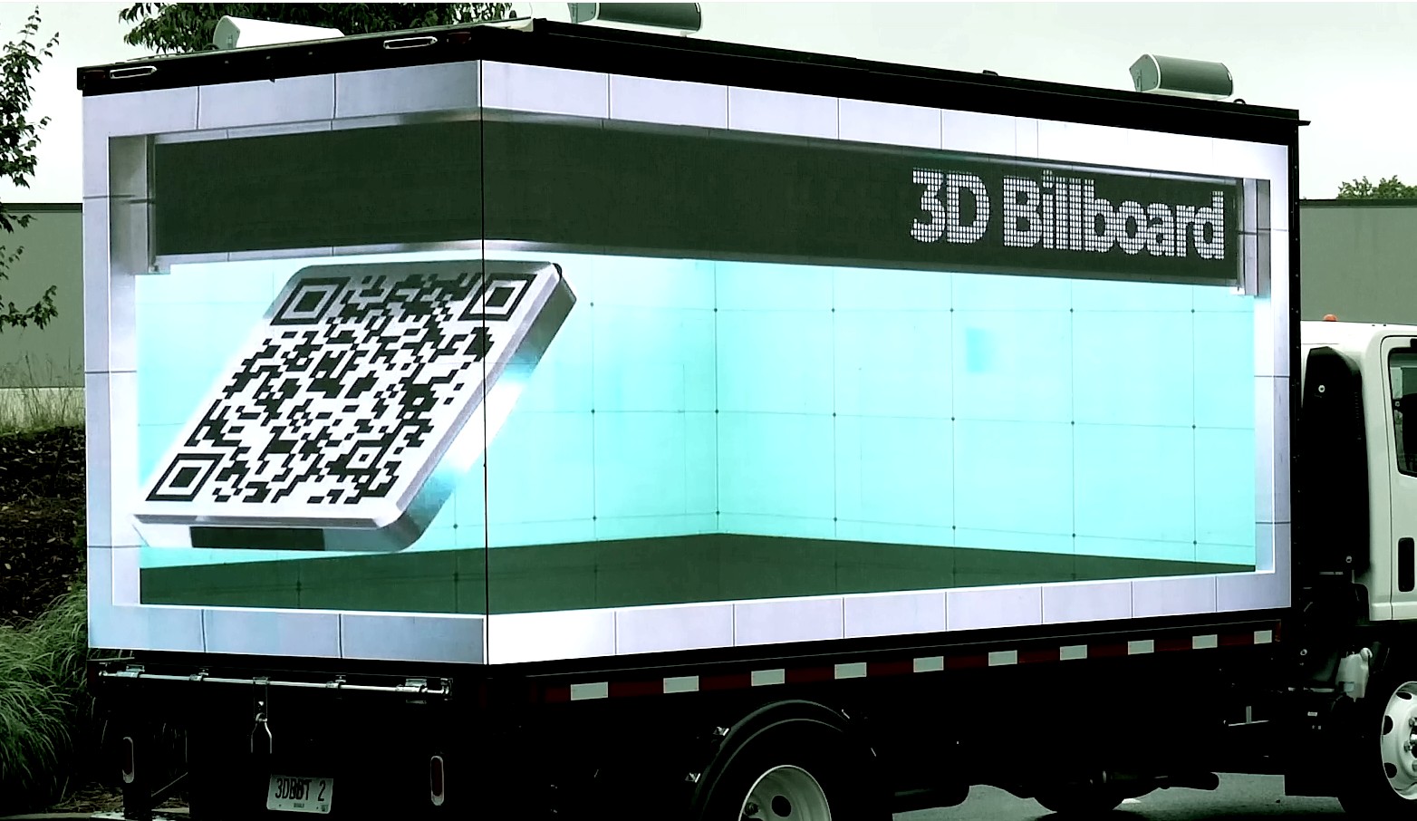 3D anamorphic QR Code video shown on the rear and right sides of a Digital LED Billboard truck
