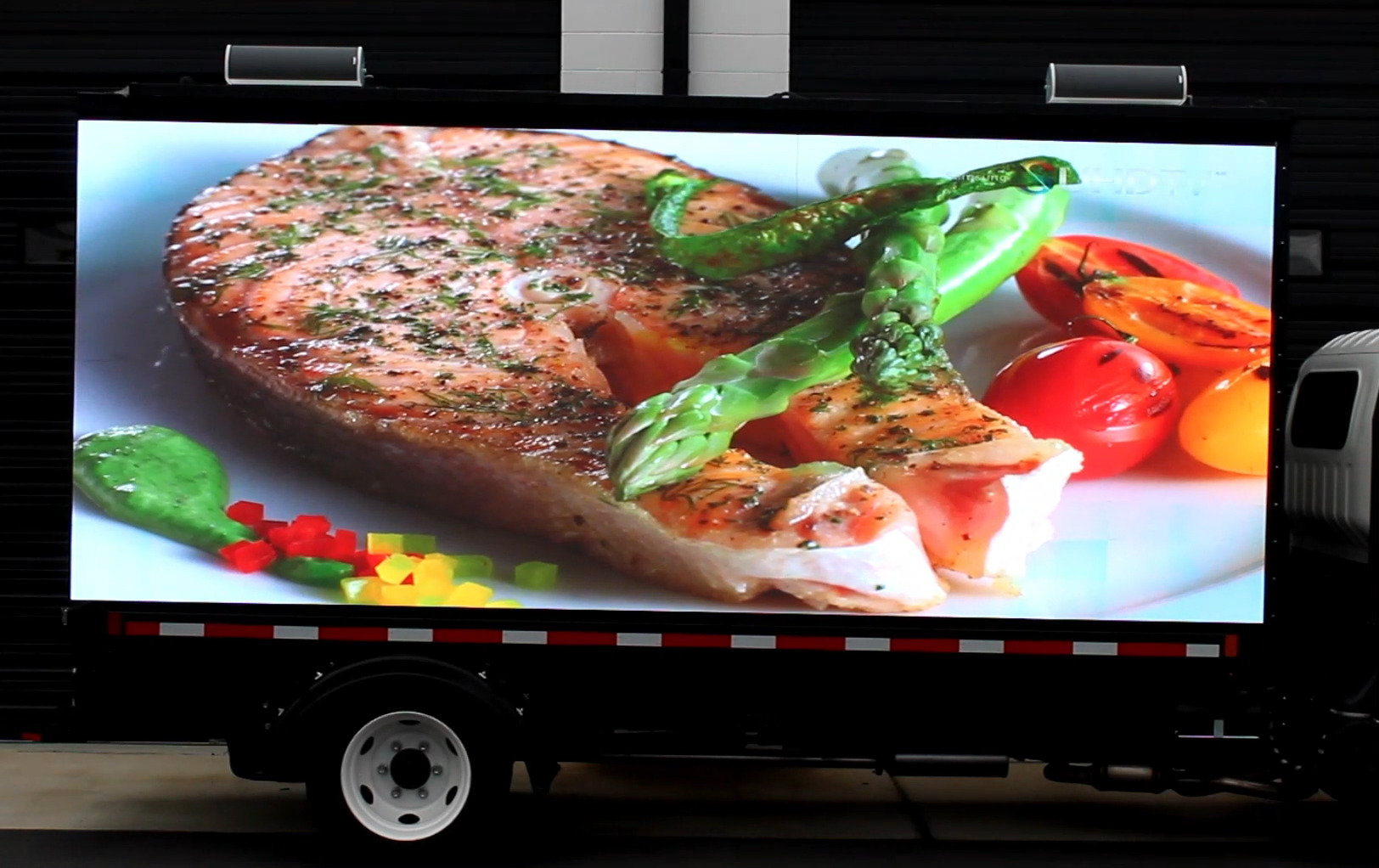High Definition LED Billboard truck showing HD video